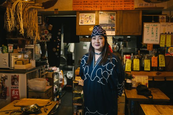 Teruyo Usa, owner and founder of Harukor, wearing Ainu robes.