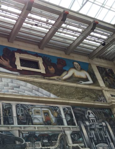 Diego Rivera's mural sprawls across a light-flooded room in the Detroit Institute of Arts.