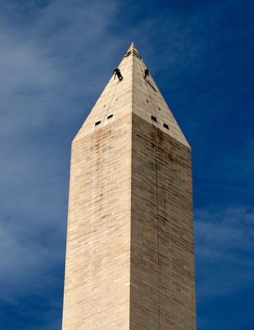 Workers assess the exterior of the Washington Monument after an earthquake in 2011.