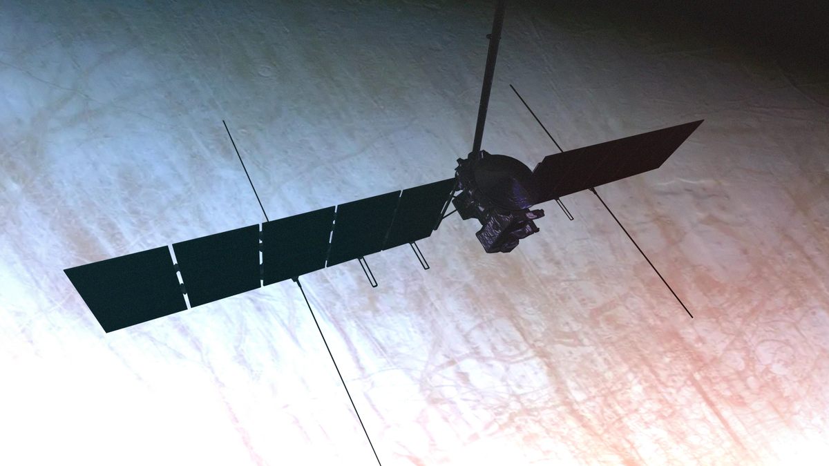 An artist's concept of NASA's Europa Clipper performing a close flyby of Jupiter's icy moon Europa.