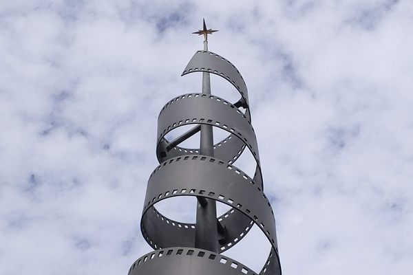 The spiral is meant to evoke a roll of film.